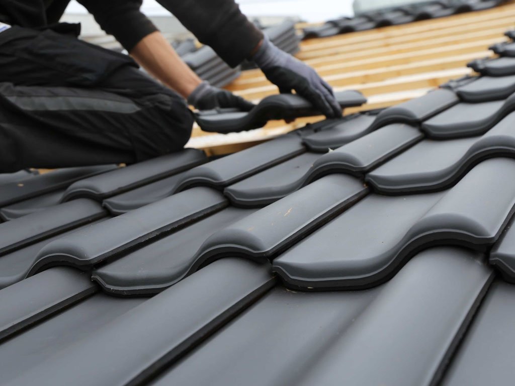 Roof tile repairs on a Colchester house after storm damage